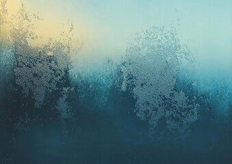 There are water drops and snowflakes on the wet window glass against an abstract background.
