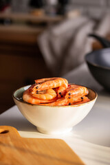 Raw shrimp in a ceramic bowl