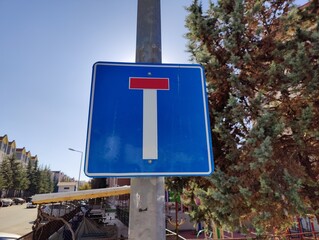 The Dead End Sign: A Symbol of Life's Unforeseen Stops and Closed Paths, Posing as a Silent...
