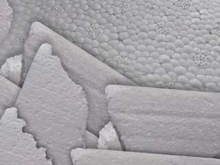white styrofoam fragments. industrial waste samples scattered around