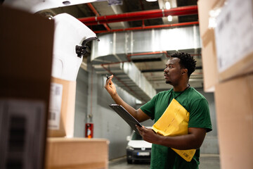 Postal worker coordinating package arrangement for shipping services.