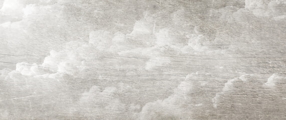 White clouds and sky on wood texture. Vintage art background. Grey old wood vector texture. Hand drawn grunge illustration. Aged painted template.