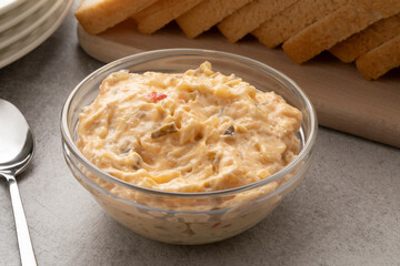 Glass bowl with homemade sandwich spread for a meal on the table
