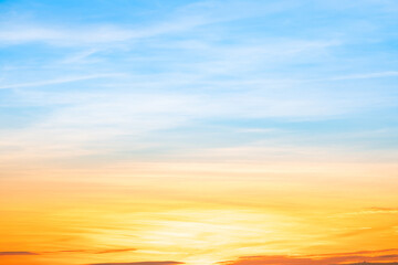Obraz premium Beautiful , luxury soft gradient orange gold clouds and sunlight on the blue sky perfect for the background, take in everning,Twilight, Large size, high definition landscape photo
