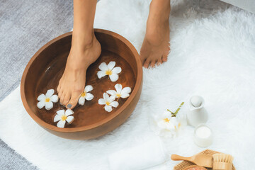 Panorama top view woman indulges in blissful foot massage at luxurious spa salon while masseur give...