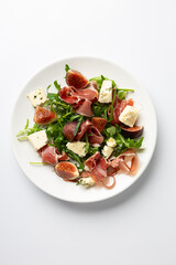 Overhead view of jamon blue cheese and figs salad