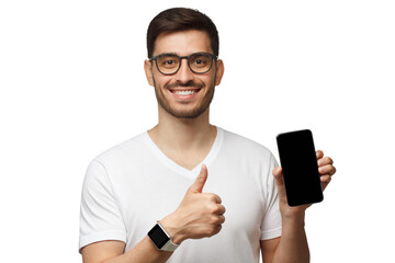 Portrait of young handsome man holding blank screen phone and showing thumb up as if approving good app