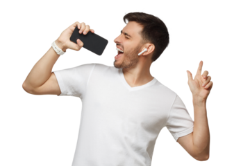 Young man in white t-shirt listening to music in wireless earphpones and singing in online karaoke app using phone