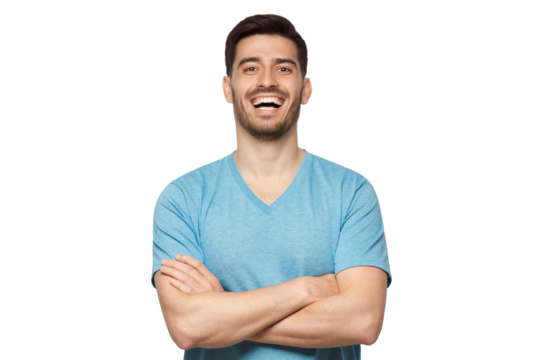 Portrait of young positive guy wearing light blue t-shirt, standing with arms crossed, laughing happily at joke