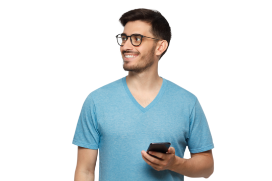 Young handsome guy wearing blue t-shirt and glasses, standing with smartphone in hand and looking to copy space