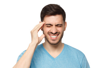 Headache concept. Young man showing how much his head hurts, experiencing pain