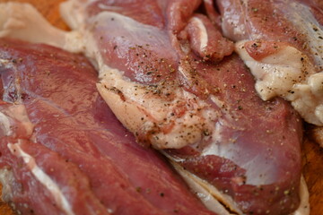 Texture of fatty fresh duck breast close up as background, texture of black meat of duck breast close up photo from above 
