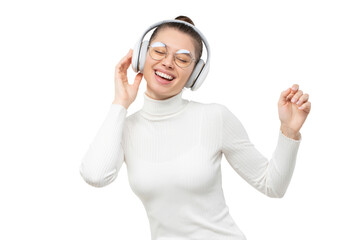 Young woman enjoying favorite song via wireless headphones, dancing to music with happy face, eyes closed, moving