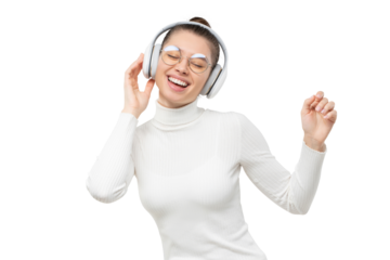 Young woman enjoying favorite song via wireless headphones, dancing to music with happy face, eyes closed, moving