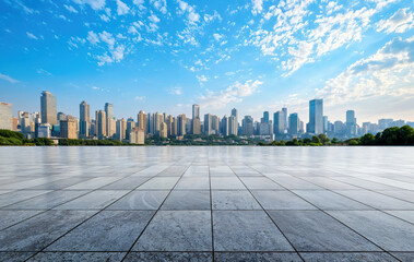 Plakat Empty marble floor overlooking modern city skyline with blue sky