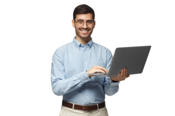 Confident young handsome businessman in blue shirt holding laptop and smiling at camera