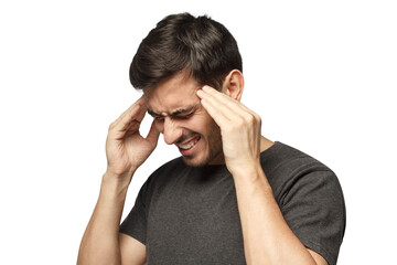 Fototapeta premium Close-up of young man touching temples with fingers as if suffering from severe migraine, feeling sick