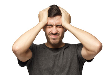 Young man showing how much head hurts, experiencing pain, looking miserable and exhausted. Headache concept.