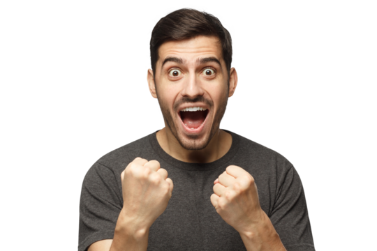 Soccer fan concept. Young attractive man shouting while his team win, raised both fist in victory gesture