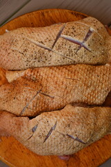  fresh duck breast with skin sliced for baking, top photo of duck breast skin texture as background, preparation for cooking, healthy home cooking, preparation for restaurant, 
