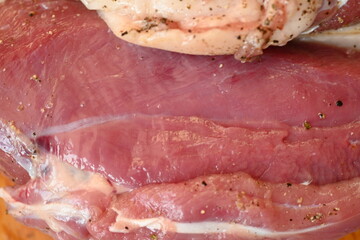 Texture of fatty fresh duck breast close up as background, texture of black meat of duck breast close up photo from above 