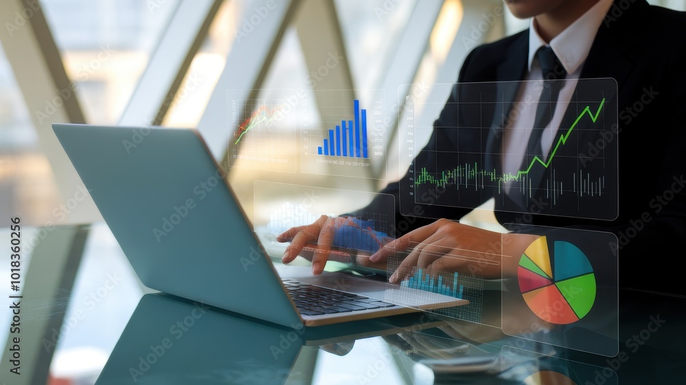 Poster businessman analyzing data on laptop with charts and graphs in a modern office setting.