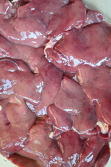 close-up texture of fresh chicken liver, chicken liver for cooking, source of iron vitamins, trace elements, healthy food, offal for cooking, 