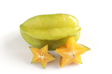 Two ripe juicy carambola starfruit whole with slice on white background. Averrhoa carambola, star apple, delicious tropical fruit.