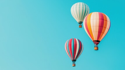 Obraz premium Colorful hot air balloons float against a clear blue sky, creating a vibrant and serene scene in the air.