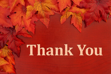 Thank You note with fall leaves on red wood
