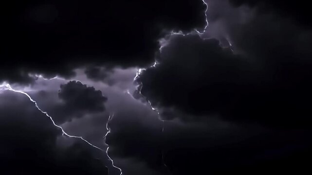Dramatic lightning streaks across a dark, stormy sky, casting an electrifying glow that highlights the intense power and energy of nature's fury
