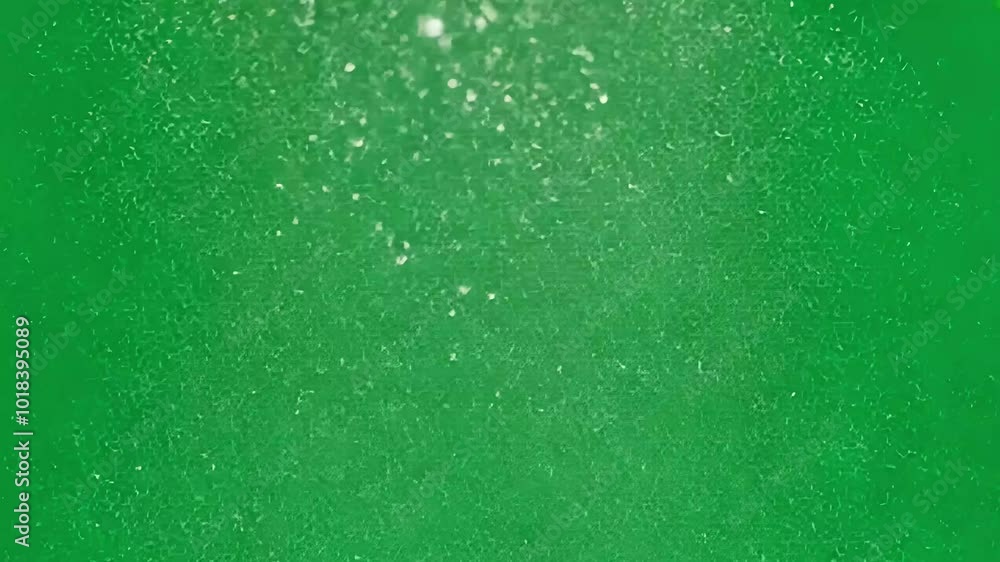 Poster falling white particles disperse against a green screen backdrop. ideal for enhancing visual effects