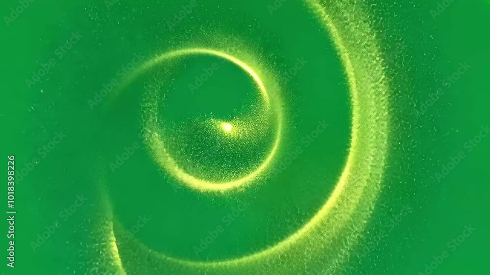 Poster golden particles swirl and rotate, forming captivating shapes against a vibrant green screen backgro