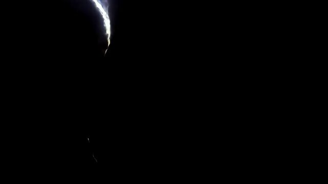 Lightning bolts striking downwards on a black background. Ideal for representing danger, electricity, and power