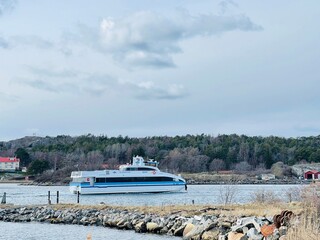 A view of red wooden houses on Donso Archipelago island .