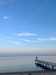 Obraz premium pier at sunset, by the beach in Denmark