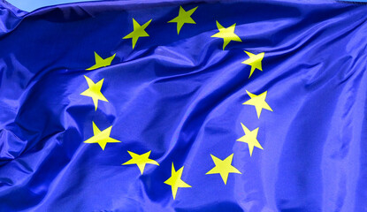 The flag of  the EU European Union flutters in the wind