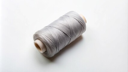 Gray sewing thread roll on white background