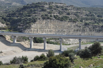 The asphalt road bridge with cars passing