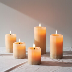 Set of Pillar Candles With Flames Softly Illuminated, Casting Warm and Inviting Glow Png.
