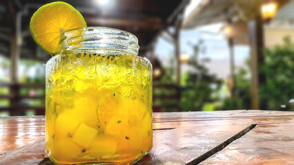 Fresh drink garnished with lemon on the cafe table