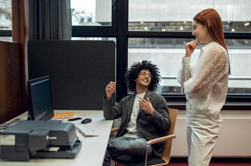 Young people talking, smiling and looking involved