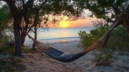 A hammock swaying gently between two trees, overlooking a calm beach at sunset, ideal for rest and rejuvenation.