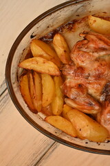 baked potatoes with roasted chicken photo from above, cinnamon crispy crust of roasted chicken and potatoes, baked dinner 