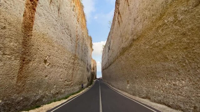 Wide shot of Tanah Barak cliff, a cliff lined gorge also known as Pantai Batu Barak, in Uluwatu region, Bali, Indonesia.