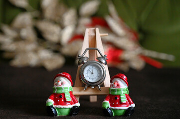 Small clock on the easel counting down to the New Year. Happy New Year.