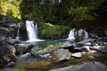 Very beautiful waterfall in autumn in the forest. Ukraine, Carpathians