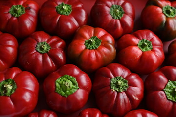 texture of red bell peppers as a background, autumn ripe juicy red bell peppers as a background, juicy organic food