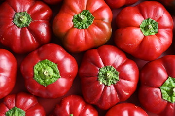 texture of red bell peppers as a background, autumn ripe juicy red bell peppers as a background, juicy organic food