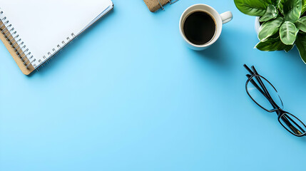 Top View of Blue Desk Background Decorated with Office Supplies